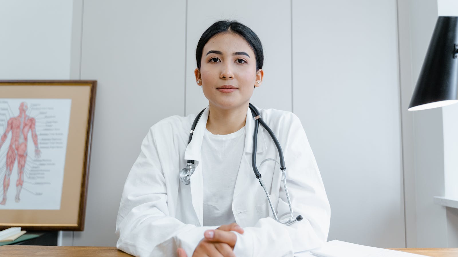 A modern healthcare professional at a clinical desk — the kind of consultation environment Hyde Park Pharmacy provides for weight management.
