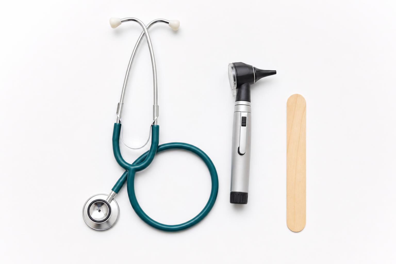 Stethoscope, otoscope and tongue depressor laid out for a pharmacist consultation