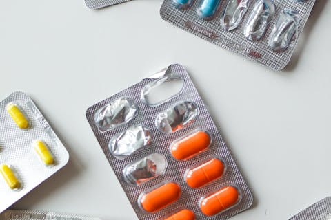 Colourful vitamin capsules in blister packs